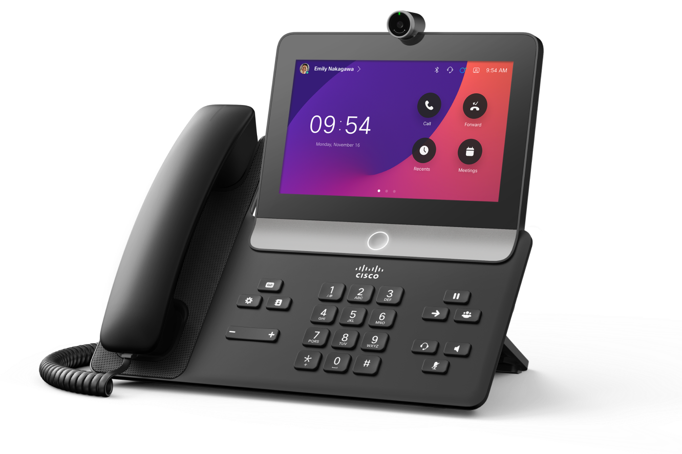 The Cisco Video Phone 8875 in the Carbon color (black).  Screen shows time of 9:54 and apps like Meetings and Call.